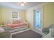 Bright bedroom featuring a twin bed with coastal accents and comfortable seating at 162 Norris Dr., Pawleys Island, SC 29585