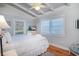 Bedroom features hardwood floors, ceiling fan, and two windows with blinds at 162 Norris Dr., Pawleys Island, SC 29585