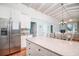 Open kitchen features a large island, stainless steel refrigerator, and adjoining dining area at 162 Norris Dr., Pawleys Island, SC 29585