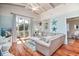 Cozy living room featuring hardwood floors, a comfortable sofa, and stylish coastal decor at 162 Norris Dr., Pawleys Island, SC 29585