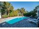 Inviting private pool surrounded by a paved patio, comfortable loungers, and tropical landscaping at 162 Norris Dr., Pawleys Island, SC 29585