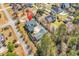 Aerial view of a residential property showcasing its placement among surrounding houses and lush green landscape at 182 Duck Blind Trail, Myrtle Beach, SC 29588