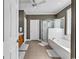 Bathroom featuring a tub, walk-in shower, and plenty of cabinet space for storage and linens at 182 Duck Blind Trail, Myrtle Beach, SC 29588