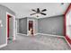 Spacious bedroom boasts plush carpeting, a ceiling fan, and easy access to an ensuite bathroom at 182 Duck Blind Trail, Myrtle Beach, SC 29588