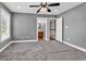 Comfortable bedroom with plush carpet, ensuite bathroom, and a bright window for natural light at 182 Duck Blind Trail, Myrtle Beach, SC 29588