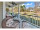 Inviting front porch featuring comfortable wicker furniture and charming columns, perfect for relaxing outdoors at 182 Duck Blind Trail, Myrtle Beach, SC 29588
