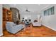 Beautiful living room with a stone fireplace, hardwood floors, and views to the back patio at 182 Duck Blind Trail, Myrtle Beach, SC 29588