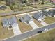 Aerial view showcasing the house with a long driveway and well-kept lawn in a neighborhood at 211 Copperwood Loop, Conway, SC 29526