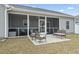 Beautiful backyard with a screened porch, patio, and white privacy fence at 211 Copperwood Loop, Conway, SC 29526