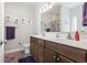 Bathroom with a double vanity, large mirror, and stylish decor providing a functional space at 211 Copperwood Loop, Conway, SC 29526
