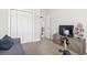 Comfortable bedroom with a closet, tv and workout machine at 211 Copperwood Loop, Conway, SC 29526
