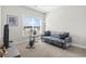 Comfortable bedroom with a couch, bike, and window offering natural light at 211 Copperwood Loop, Conway, SC 29526