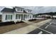 Community pool area surrounded by well-maintained landscaping and a secure black fence at 211 Copperwood Loop, Conway, SC 29526