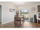 Bright dining area with natural light, chandelier, and sliding glass doors to the backyard at 211 Copperwood Loop, Conway, SC 29526
