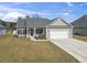 Beautiful home with a two-car garage and lovely landscaping at 211 Copperwood Loop, Conway, SC 29526