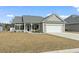 Charming single-story home with a well-maintained lawn, landscaping, and attached two car garage at 211 Copperwood Loop, Conway, SC 29526