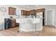 Kitchen featuring stainless steel appliances, a granite countertop, white bar stools, and wood-look flooring at 211 Copperwood Loop, Conway, SC 29526
