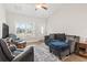 Cozy living room featuring ample seating, natural light, and modern decor at 211 Copperwood Loop, Conway, SC 29526