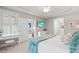 Bright bedroom with white plantation shutters, TV, and ensuite bathroom access at 2180 Waterview Dr. # 713, North Myrtle Beach, SC 29582