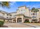 Elegant condominium complex featuring a stone paved driveway and coastal landscaping under a bright sky at 2180 Waterview Dr. # 713, North Myrtle Beach, SC 29582