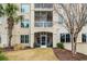 Building exterior featuring multiple screened porches and tropical palm trees at 2180 Waterview Dr. # 713, North Myrtle Beach, SC 29582