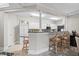 Well-lit kitchen featuring bar stool seating, bright white cabinets, and a functional layout for culinary enthusiasts at 2180 Waterview Dr. # 713, North Myrtle Beach, SC 29582