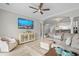 Serene living space featuring neutral tones, tile flooring, a modern ceiling fan and open layout with dining area at 2180 Waterview Dr. # 713, North Myrtle Beach, SC 29582