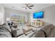 Inviting living room with plush seating, a ceiling fan, and scenic views through sliding glass doors at 2180 Waterview Dr. # 713, North Myrtle Beach, SC 29582
