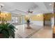 Lobby featuring tile floors, chandelier, tropical plants, and natural lighting at 2180 Waterview Dr. # 713, North Myrtle Beach, SC 29582