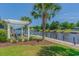 Relaxing waterfront view with a pergola, seating, and picturesque scenery along the waterway at 2180 Waterview Dr. # 713, North Myrtle Beach, SC 29582