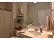 Well-lit bathroom featuring a modern vanity, decorative shelving, and stylish fixtures at 2441 Capri Court, Conway, SC 29527