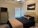 Comfortable bedroom with plush bedding, decorative pillows, and a whale painting at 2441 Capri Court, Conway, SC 29527