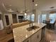 View of the kitchen island overlooking the living and dining areas in an open concept layout at 2441 Capri Court, Conway, SC 29527