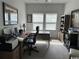 Well-lit home office features a large desk, comfortable chair, and ample storage space at 2441 Capri Court, Conway, SC 29527