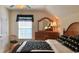 Comfortable bedroom with a bed, wooden dresser, and a window providing natural light at 259 19Th Ave. S, Myrtle Beach, SC 29577