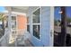 Cozy front porch with white chairs, creating a relaxing outdoor space by the entrance at 259 19Th Ave. S, Myrtle Beach, SC 29577