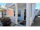 Inviting front porch with white railings and posts, offering a cozy seating area at 259 19Th Ave. S, Myrtle Beach, SC 29577