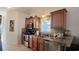 Well-equipped kitchen with tile countertops and wooden cabinetry at 259 19Th Ave. S, Myrtle Beach, SC 29577
