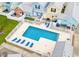 Aerial view of a community pool with lounge chairs and manicured surroundings at 259 19Th Ave. S, Myrtle Beach, SC 29577