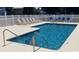 Sparkling blue swimming pool with lounge chairs, perfect for relaxation and recreation at 259 19Th Ave. S, Myrtle Beach, SC 29577