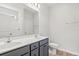 Modern bathroom featuring double sinks with granite countertops, toilet, and walk-in shower at 261 Six Mile Creek Dr., Georgetown, SC 29440