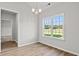 Bright dining room showcases a view of the lush surroundings through the large window at 261 Six Mile Creek Dr., Georgetown, SC 29440