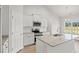 This spacious kitchen features a granite island, stainless appliances, and stylish pendant lighting at 261 Six Mile Creek Dr., Georgetown, SC 29440