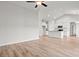 Open-concept living room and kitchen area features light wood flooring and high vaulted ceilings at 261 Six Mile Creek Dr., Georgetown, SC 29440