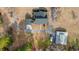 Aerial view showcasing the property's layout with the house, outbuilding, and winding driveway on a large lot at 3618 Highway 430, Nichols, SC 29581