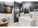 Bathroom featuring black walls, white accents, vanity, and mosaic tile flooring at 3618 Highway 430, Nichols, SC 29581