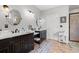 Bathroom featuring double sinks, custom cabinets, decorative stool and walk-in shower at 3618 Highway 430, Nichols, SC 29581