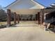 Spacious covered carport featuring brick columns and ample space for parking and outdoor activities at 3618 Highway 430, Nichols, SC 29581