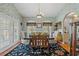 Formal dining room with elegant chandelier, large windows, and stylish wallpaper at 3618 Highway 430, Nichols, SC 29581