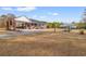 Expansive property featuring a brick home with a carport, screened porch, and additional covered parking at 3618 Highway 430, Nichols, SC 29581